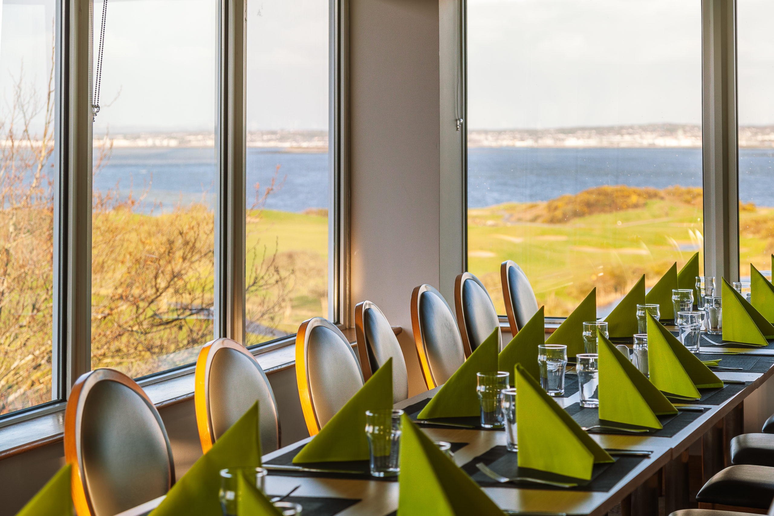 special occasion tables and chairs lined up for formal event with Galway Bay Golf Resort as backdrop